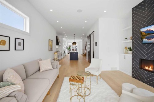 1712 18 Avenue Nw, Calgary, AB - Indoor Photo Showing Living Room With Fireplace