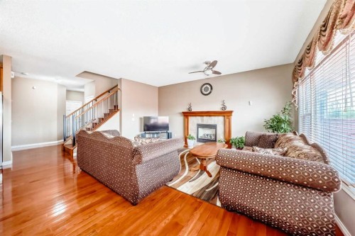 148 Saddlecrest Gardens Ne, Calgary, AB - Indoor Photo Showing Living Room With Fireplace