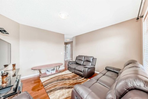 148 Saddlecrest Gardens Ne, Calgary, AB - Indoor Photo Showing Living Room