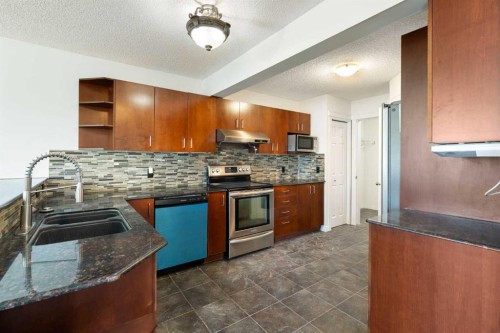 231 Hawkmere Road, Chestermere, AB - Indoor Photo Showing Kitchen With Double Sink