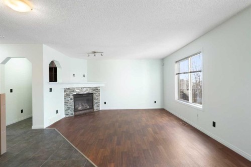 231 Hawkmere Road, Chestermere, AB - Indoor Photo Showing Living Room With Fireplace