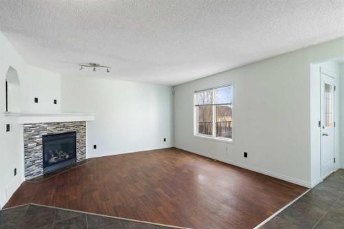 231 Hawkmere Road, Chestermere, AB - Indoor Photo Showing Other Room With Fireplace
