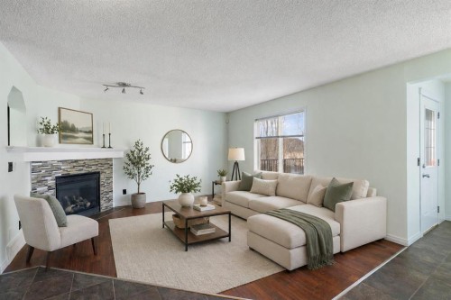 231 Hawkmere Road, Chestermere, AB - Indoor Photo Showing Living Room With Fireplace