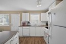260 Stonemere Place, Chestermere, AB  - Indoor Photo Showing Kitchen With Double Sink 