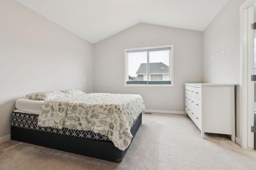 107 Sundown View, Cochrane, AB - Indoor Photo Showing Bedroom
