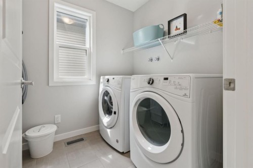 107 Sundown View, Cochrane, AB - Indoor Photo Showing Laundry Room