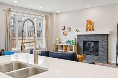 107 Sundown View, Cochrane, AB - Indoor With Fireplace