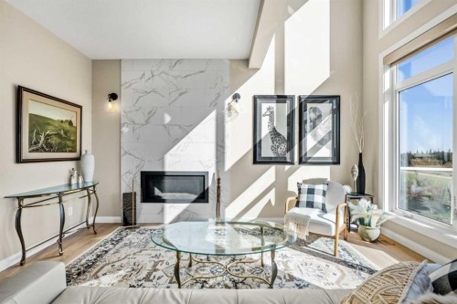 51 Creekstone Way Sw, Calgary, AB - Indoor Photo Showing Living Room With Fireplace