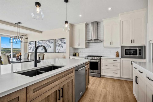 51 Creekstone Way Sw, Calgary, AB - Indoor Photo Showing Kitchen With Double Sink With Upgraded Kitchen