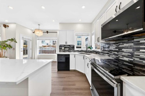 502 Panamount Boulevard Nw, Calgary, AB - Indoor Photo Showing Kitchen With Upgraded Kitchen