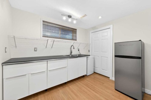 502 Panamount Boulevard Nw, Calgary, AB - Indoor Photo Showing Kitchen With Double Sink