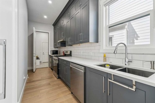 19 Duhram Way, Rural Rocky View County, AB - Indoor Photo Showing Kitchen With Double Sink With Upgraded Kitchen