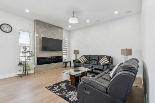 19 Duhram Way, Rural Rocky View County, AB - Indoor Photo Showing Living Room With Fireplace