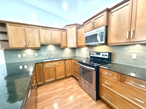 501 Sunvale Crescent Ne, High River, AB - Indoor Photo Showing Kitchen With Upgraded Kitchen