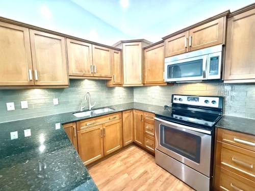 501 Sunvale Crescent Ne, High River, AB - Indoor Photo Showing Kitchen