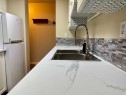 83E-231 Heritage Drive Se, Calgary, AB  - Indoor Photo Showing Kitchen With Double Sink 