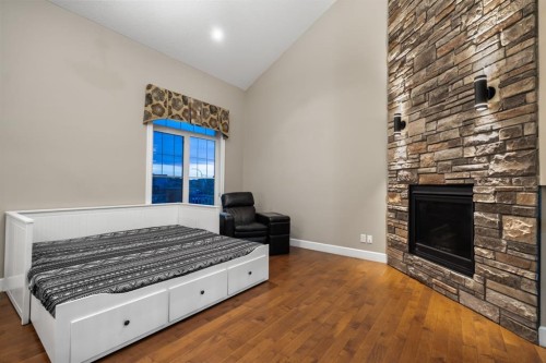209 Cityscape Gardens Ne, Calgary, AB - Indoor Photo Showing Bedroom With Fireplace