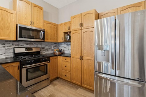 17 Prestwick Pond Terrace Se, Calgary, AB - Indoor Photo Showing Kitchen With Stainless Steel Kitchen