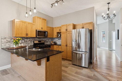 17 Prestwick Pond Terrace Se, Calgary, AB - Indoor Photo Showing Kitchen With Stainless Steel Kitchen With Double Sink With Upgraded Kitchen