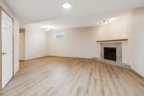 17 Prestwick Pond Terrace Se, Calgary, AB - Indoor With Fireplace