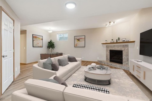 17 Prestwick Pond Terrace Se, Calgary, AB - Indoor Photo Showing Living Room With Fireplace