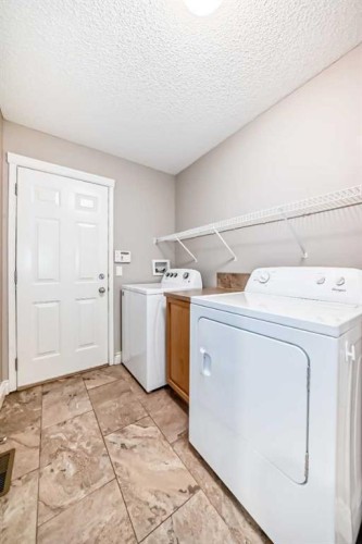 141 Somerglen Way Sw, Calgary, AB - Indoor Photo Showing Laundry Room