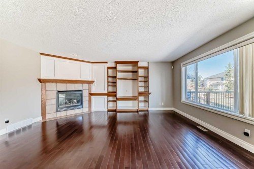 141 Somerglen Way Sw, Calgary, AB - Indoor Photo Showing Living Room With Fireplace