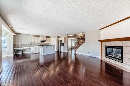 141 Somerglen Way Sw, Calgary, AB - Indoor Photo Showing Living Room With Fireplace