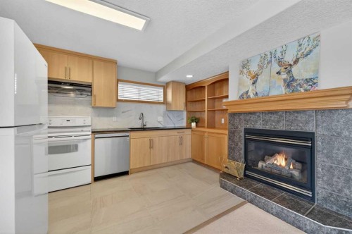 359 Rocky Ridge Drive Nw, Calgary, AB - Indoor With Fireplace
