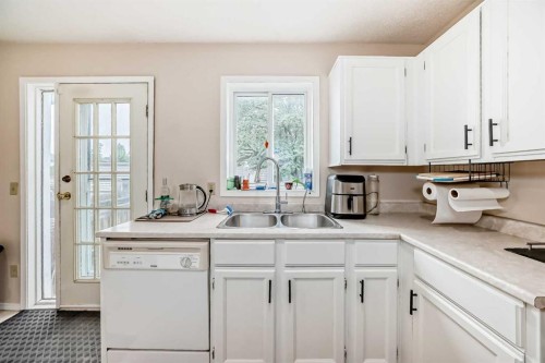 110 Edgeburn Crescent Nw, Calgary, AB - Indoor Photo Showing Kitchen With Double Sink