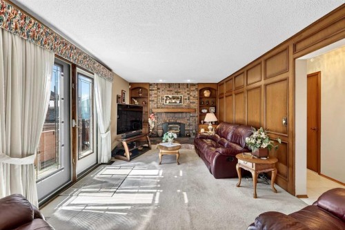 168 Templewood Drive Ne, Calgary, AB - Indoor Photo Showing Living Room With Fireplace
