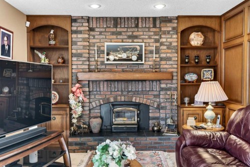 168 Templewood Drive Ne, Calgary, AB - Indoor Photo Showing Living Room With Fireplace