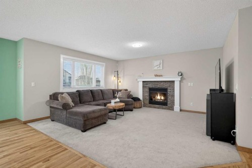 112 West Creek Close, Chestermere, AB - Indoor Photo Showing Living Room With Fireplace