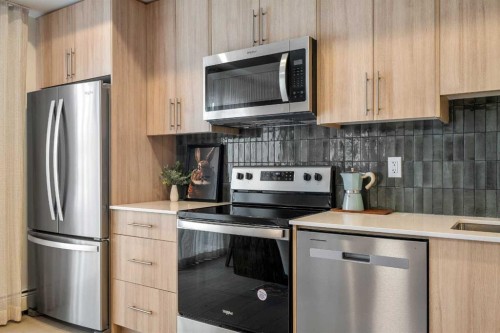2203-9655 Bowfort Road Nw, Calgary, AB - Indoor Photo Showing Kitchen With Stainless Steel Kitchen