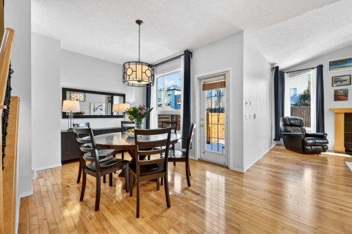 865 Citadel Way Nw, Calgary, AB - Indoor Photo Showing Dining Room With Fireplace