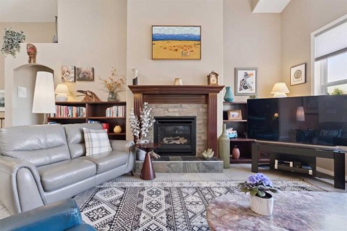 202 Tusslewood Terrace Nw, Calgary, AB - Indoor Photo Showing Living Room With Fireplace