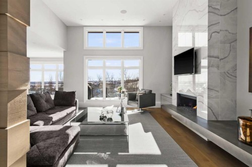 34 Elveden Heights Sw, Calgary, AB - Indoor Photo Showing Living Room With Fireplace