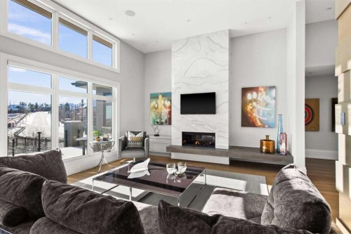 34 Elveden Heights Sw, Calgary, AB - Indoor Photo Showing Living Room With Fireplace