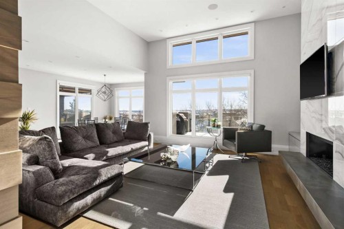 34 Elveden Heights Sw, Calgary, AB - Indoor Photo Showing Living Room With Fireplace