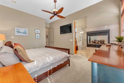 183 Westview Drive Sw, Calgary, AB - Indoor Photo Showing Bedroom With Fireplace
