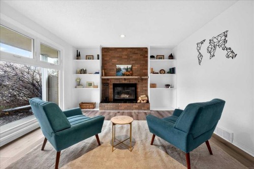 611 Lake Linnet Crescent Se, Calgary, AB - Indoor Photo Showing Living Room With Fireplace