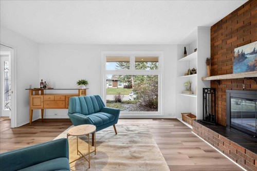 611 Lake Linnet Crescent Se, Calgary, AB - Indoor Photo Showing Living Room With Fireplace