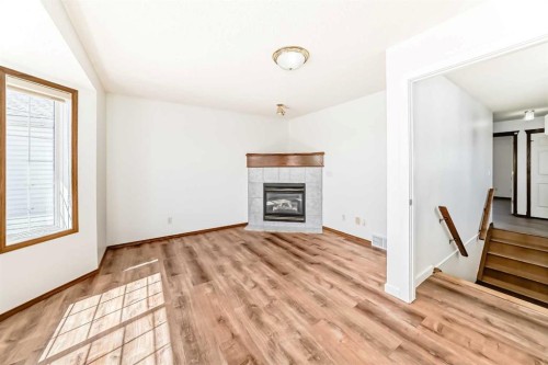 141 Arbour Crest Mews Nw, Calgary, AB - Indoor Photo Showing Living Room With Fireplace