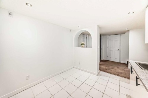 141 Arbour Crest Mews Nw, Calgary, AB - Indoor Photo Showing Kitchen With Double Sink