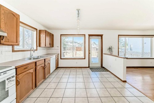 141 Arbour Crest Mews Nw, Calgary, AB - Indoor Photo Showing Kitchen With Double Sink