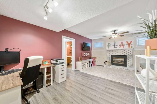 5 Shawglen Court Sw, Calgary, AB - Indoor Photo Showing Office With Fireplace
