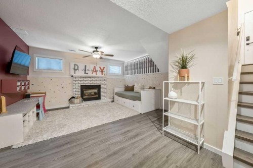 5 Shawglen Court Sw, Calgary, AB - Indoor With Fireplace
