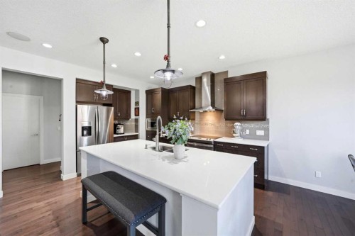 312 Sunset View, Cochrane, AB - Indoor Photo Showing Kitchen With Stainless Steel Kitchen With Upgraded Kitchen