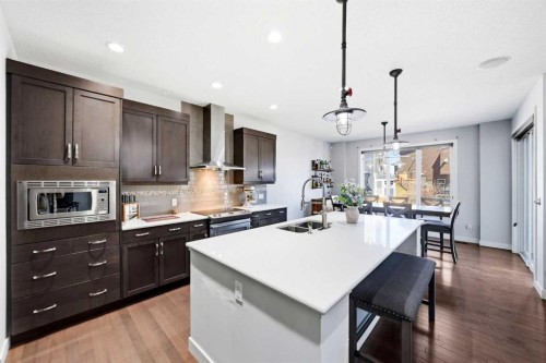 312 Sunset View, Cochrane, AB - Indoor Photo Showing Kitchen With Double Sink With Upgraded Kitchen