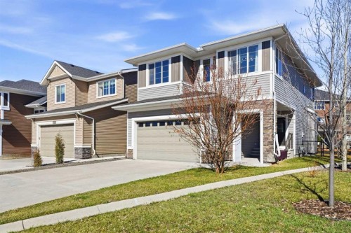 312 Sunset View, Cochrane, AB - Outdoor With Facade